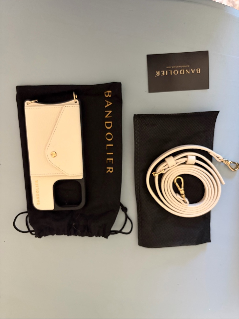 Bandolier White Leather Crossbody Phone Case with Gold Accents and Strap